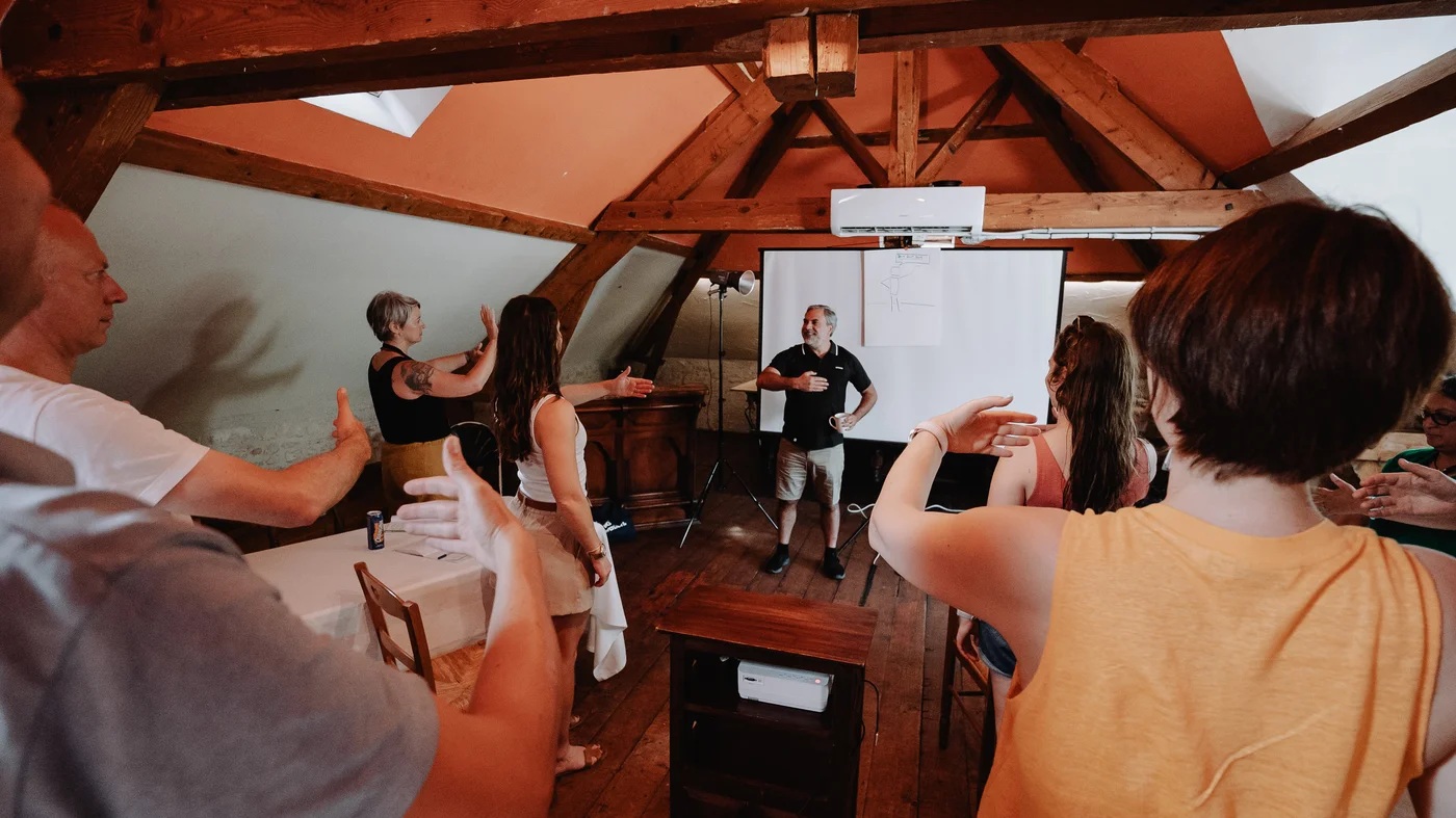 Workshop participants working in a plenary room